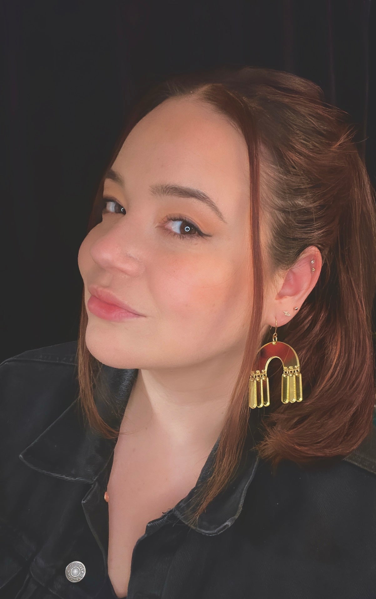 girl wearing mad planet mirrored gold arches handmade earrings